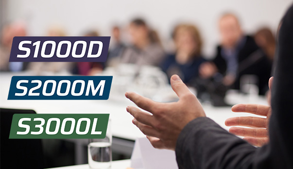 stock photo of a meeting with people blurred in the background and the speaker's hands in the foreground with simplified S Series logos on the left
